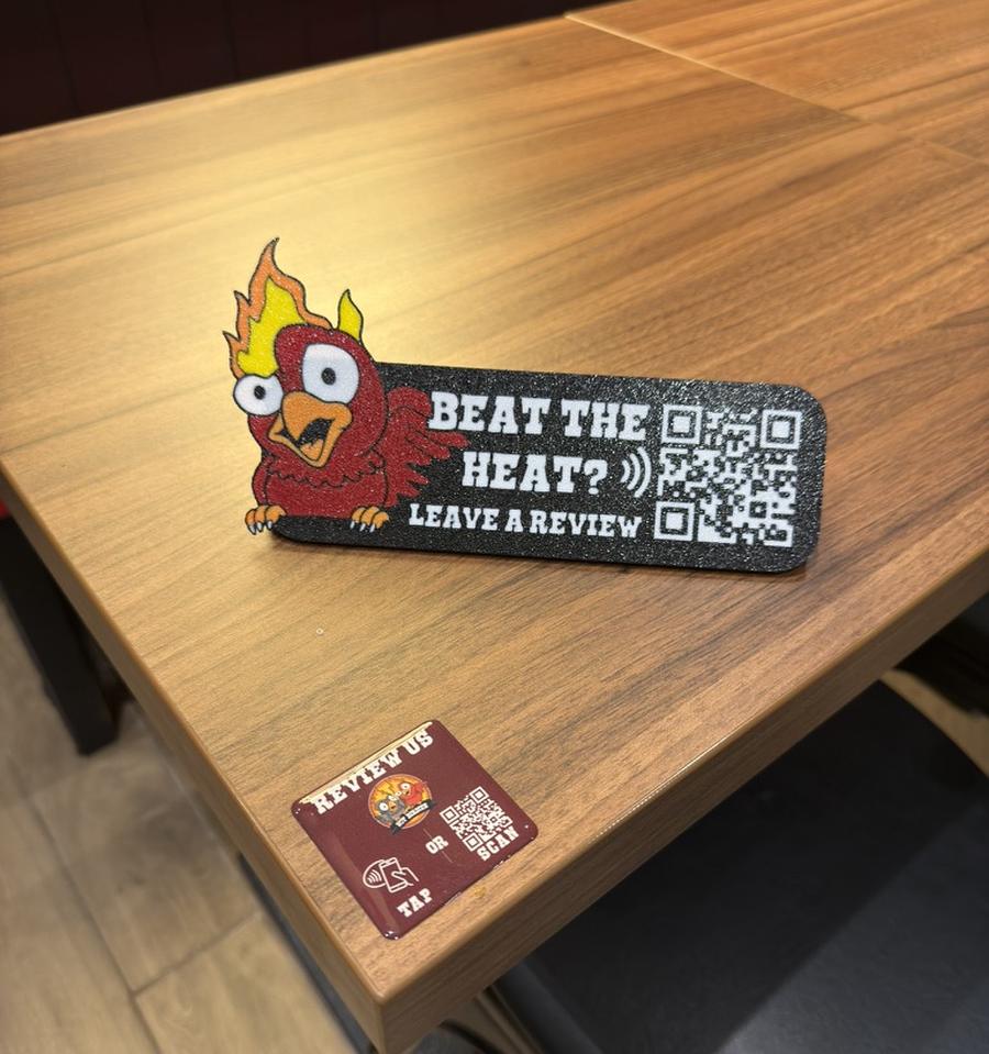 A 3D-printed table talker and table puck, custom-branded for a restaurant
